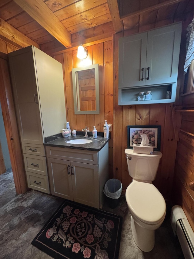 1083 N Rd, Ripley, ME 04930 - half bathroom with wooden ceiling, toilet, beamed ceiling, wood walls, and a baseboard heating unit