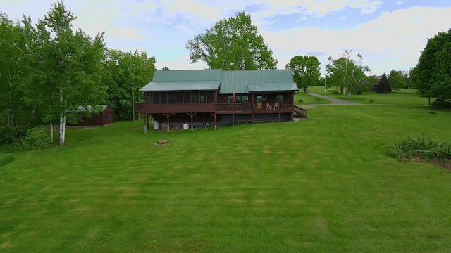 1083 N Rd, Ripley, ME 04930 - rear view of property featuring a yard, a wooden deck, and metal roof