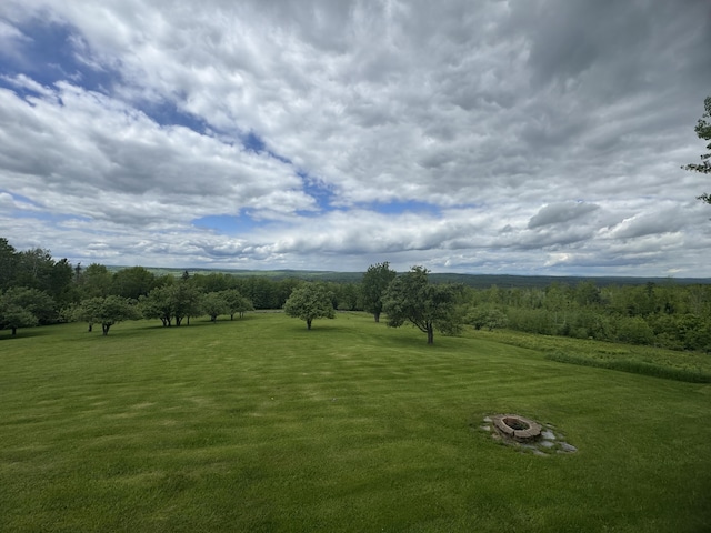 1083 N Rd, Ripley, ME 04930 - view of grassy yard with a fire pit