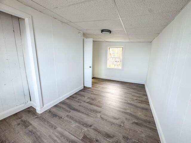 108/9 113 Sandy Beach Rd, Glenburn, ME 04401 - unfurnished room featuring a paneled ceiling, wood finished floors, and baseboards