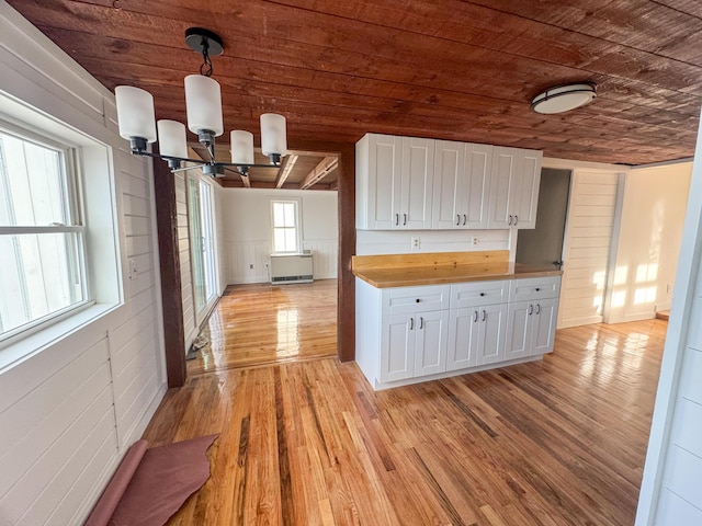 108/9 113 Sandy Beach Rd, Glenburn, ME 04401 - kitchen featuring white cabinetry, wooden ceiling, an inviting chandelier, light wood-type flooring, and butcher block countertops