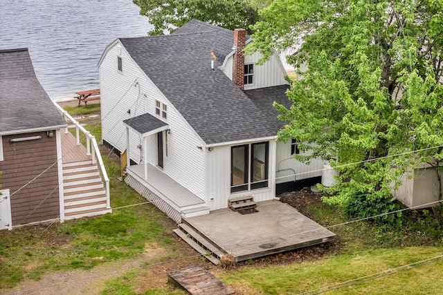108/9 113 Sandy Beach Rd, Glenburn, ME 04401 - back of property featuring roof with shingles, a deck, a chimney, and stairway