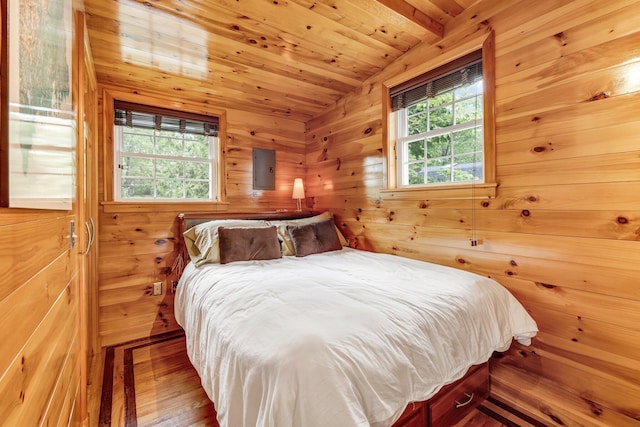108/9 113 Sandy Beach Rd, Glenburn, ME 04401 - bedroom with wood walls, wood finished floors, wooden ceiling, vaulted ceiling, and electric panel