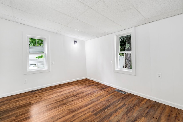 108/9 113 Sandy Beach Rd, Glenburn, ME 04401 - unfurnished room with dark wood-type flooring and a drop ceiling