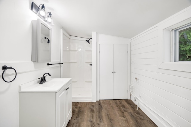108/9 113 Sandy Beach Rd, Glenburn, ME 04401 - full bathroom with vanity, a shower, wood finished floors, and wood walls