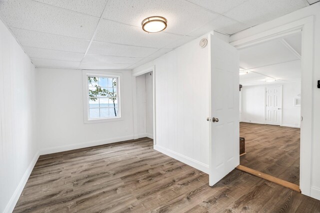 108/9 113 Sandy Beach Rd, Glenburn, ME 04401 - spare room with a drop ceiling, wood finished floors, and a smoke detector