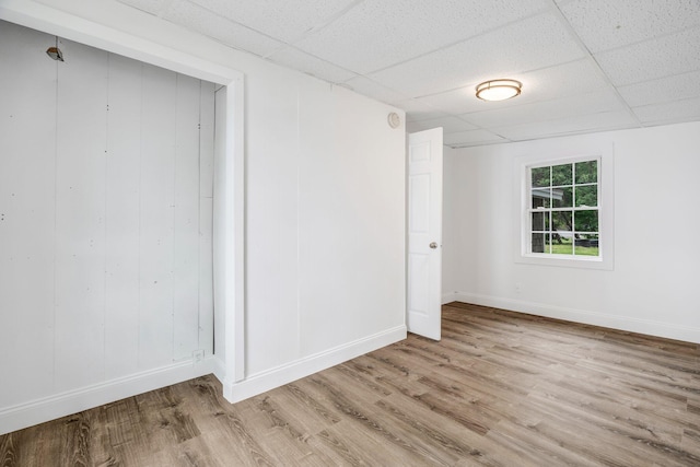 108/9 113 Sandy Beach Rd, Glenburn, ME 04401 - empty room with wood finished floors and a drop ceiling