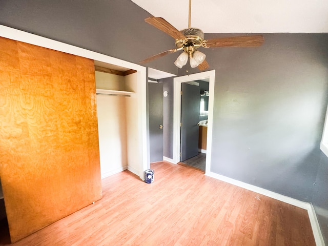 108/9 113 Sandy Beach Rd, Glenburn, ME 04401 - unfurnished bedroom featuring wood finished floors, a closet, and a ceiling fan