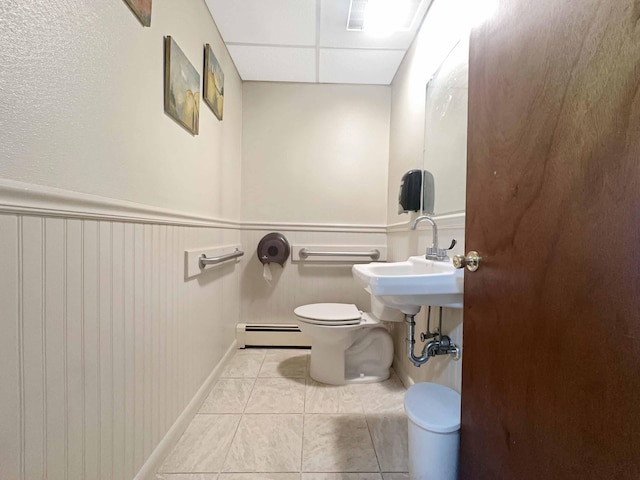 1716 Main St, Mapleton, ME 04757 - half bathroom with toilet, a baseboard radiator, and tile patterned flooring