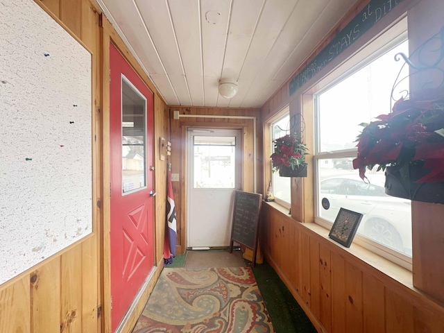 1716 Main St, Mapleton, ME 04757 - doorway to outside featuring wooden walls and wainscoting
