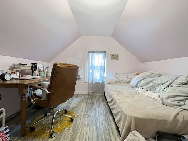 1716 Main St, Mapleton, ME 04757 - bedroom with vaulted ceiling and wood finished floors