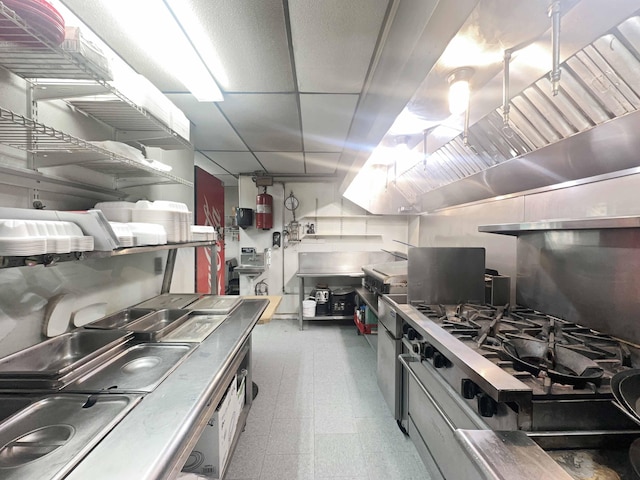1716 Main St, Mapleton, ME 04757 - kitchen featuring tile patterned floors and stainless steel gas range oven