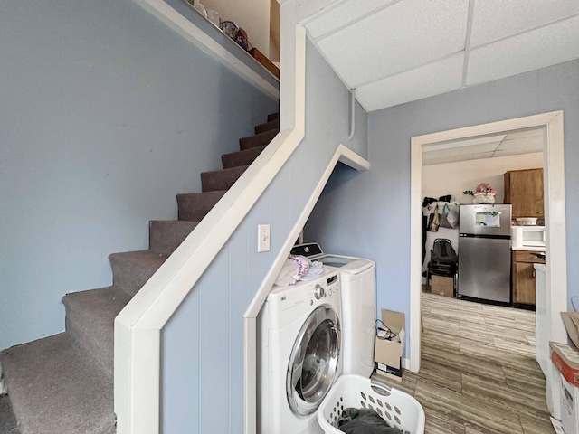 1716 Main St, Mapleton, ME 04757 - laundry room featuring laundry area, wood finished floors, and washer and clothes dryer