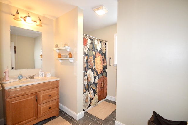 full bathroom with baseboards, tile patterned flooring, a shower with curtain, and vanity