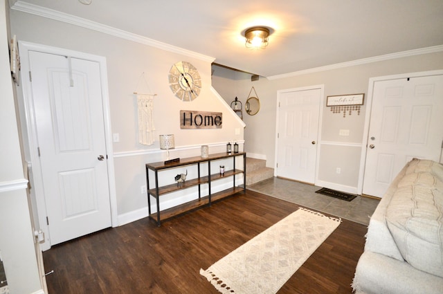foyer with stairs, baseboards, crown molding, and wood finished floors