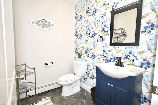 bathroom with vanity, baseboards, a baseboard heating unit, wallpapered walls, and toilet