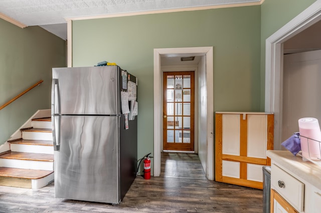 kitchen featuring light countertops, freestanding refrigerator, and dark wood finished floors