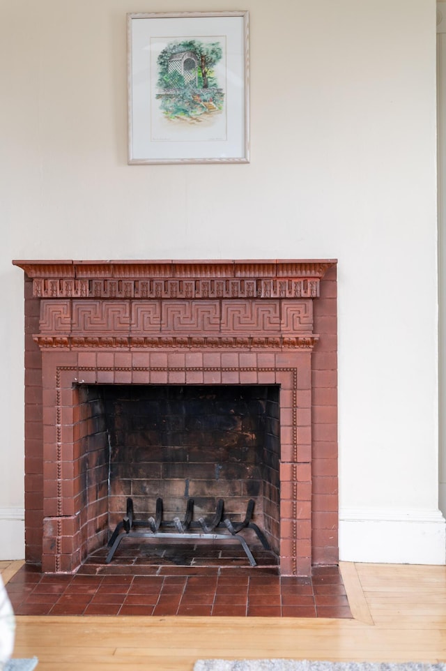 details with a tile fireplace