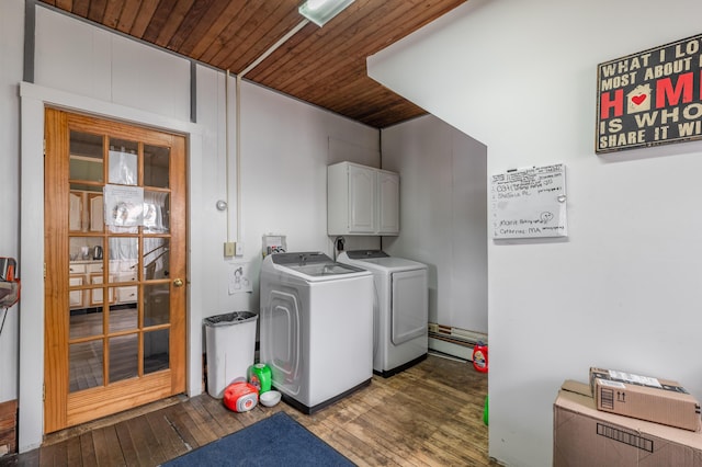 clothes washing area featuring independent washer and dryer, hardwood / wood-style flooring, wood ceiling, and cabinet space