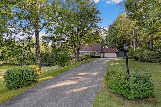 252 General Turner Hill Rd, Turner, ME 04282 - ranch-style house with aphalt driveway and a front yard