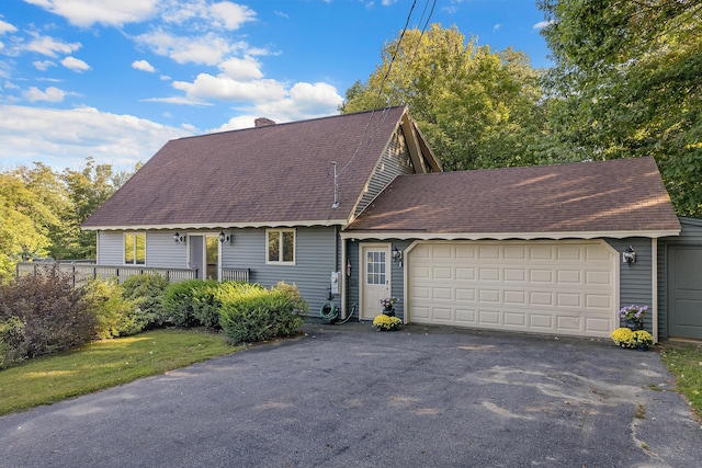 252 General Turner Hill Rd, Turner, ME 04282 - view of front of property featuring a chimney, an attached garage, driveway, and roof with shingles
