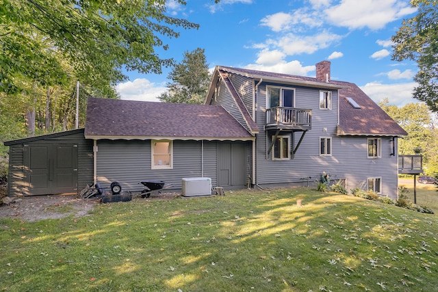 252 General Turner Hill Rd, Turner, ME 04282 - back of house featuring a balcony, a chimney, an outbuilding, a yard, and a shingled roof