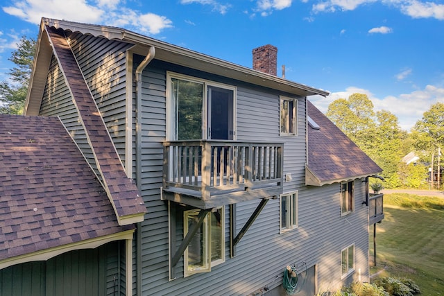 252 General Turner Hill Rd, Turner, ME 04282 - view of home's exterior with a chimney and a shingled roof