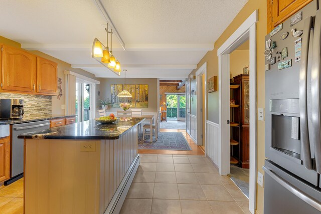 252 General Turner Hill Rd, Turner, ME 04282 - kitchen featuring plenty of natural light, a center island, backsplash, and appliances with stainless steel finishes