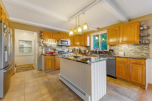 252 General Turner Hill Rd, Turner, ME 04282 - kitchen with baseboard heating, tasteful backsplash, light tile patterned floors, and stainless steel appliances