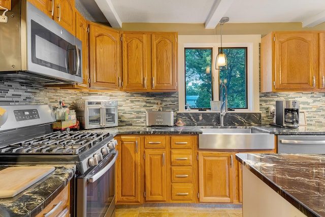 252 General Turner Hill Rd, Turner, ME 04282 - kitchen with a sink, appliances with stainless steel finishes, beam ceiling, dark stone counters, and decorative backsplash