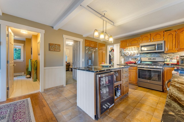 252 General Turner Hill Rd, Turner, ME 04282 - kitchen with beamed ceiling, brown cabinetry, a kitchen island, beverage cooler, and stainless steel appliances