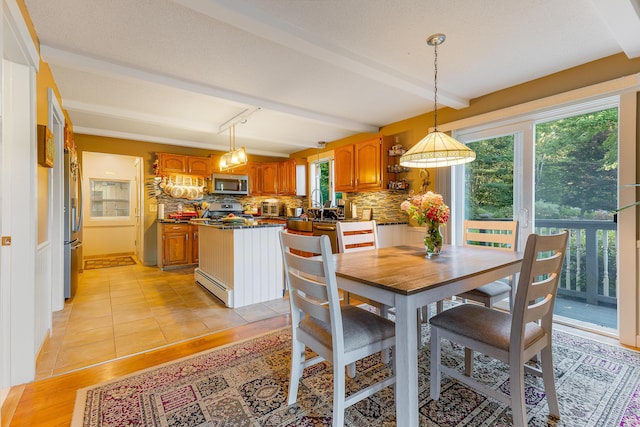 252 General Turner Hill Rd, Turner, ME 04282 - dining space featuring beamed ceiling, light wood-style floors, and baseboard heating