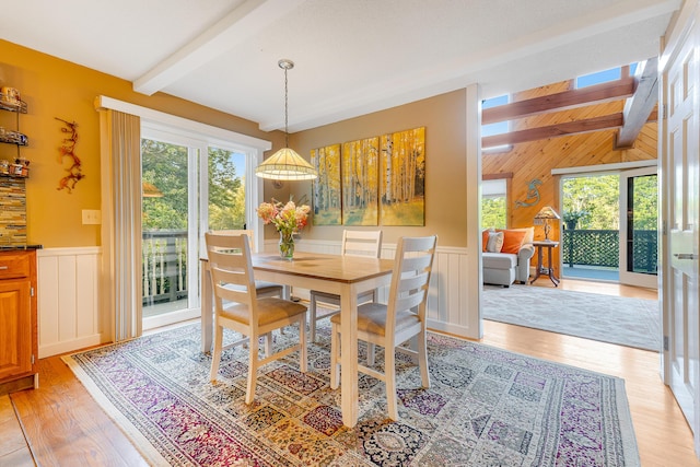252 General Turner Hill Rd, Turner, ME 04282 - dining space featuring light wood-type flooring, beamed ceiling, and a wainscoted wall