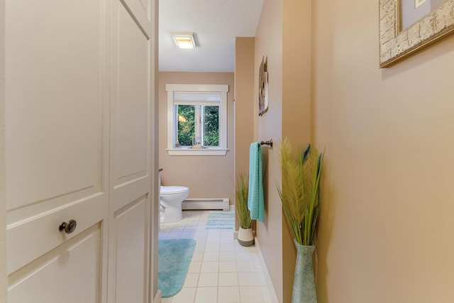 252 General Turner Hill Rd, Turner, ME 04282 - bathroom featuring toilet, a baseboard heating unit, baseboards, and tile patterned flooring