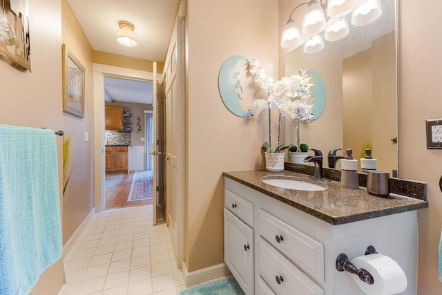252 General Turner Hill Rd, Turner, ME 04282 - bathroom with tile patterned flooring, vanity, and decorative backsplash