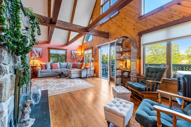 252 General Turner Hill Rd, Turner, ME 04282 - living area featuring high vaulted ceiling, wooden walls, beam ceiling, and wood finished floors
