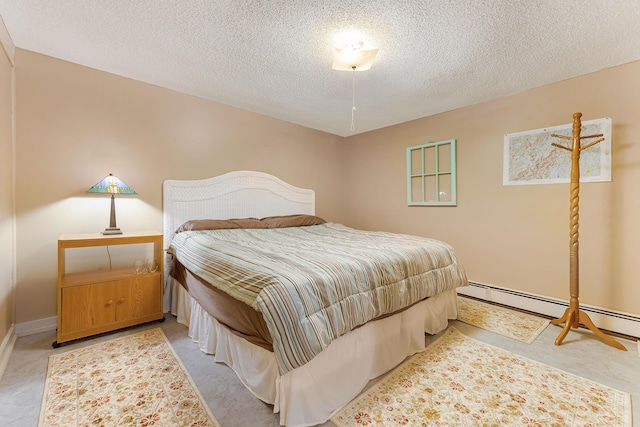252 General Turner Hill Rd, Turner, ME 04282 - bedroom featuring a baseboard radiator, a textured ceiling, and baseboards