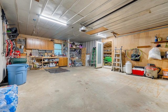 252 General Turner Hill Rd, Turner, ME 04282 - garage with a garage door opener and a workshop area
