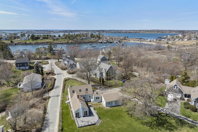 birds eye view of property with a water view and a residential view