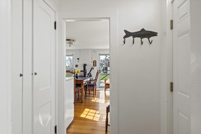 hall with light wood-style flooring