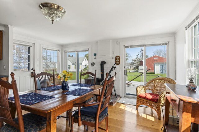 dining room featuring plenty of natural light and light wood-style flooring