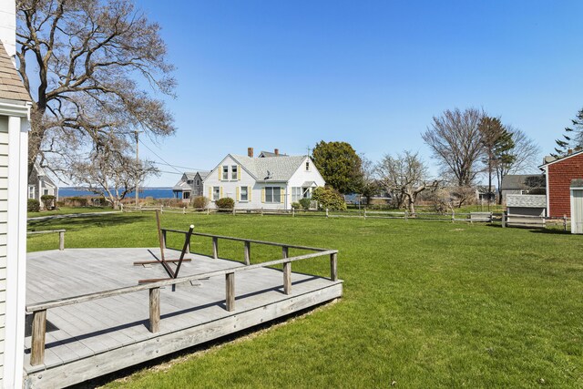 view of yard with fence and a deck