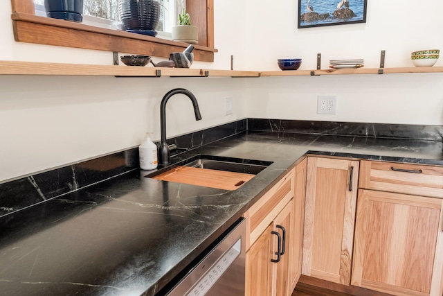 kitchen with dishwasher, light brown cabinetry, open shelves, and a sink