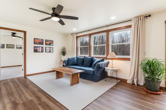 living room with wood finished floors, baseboards, recessed lighting, and ceiling fan