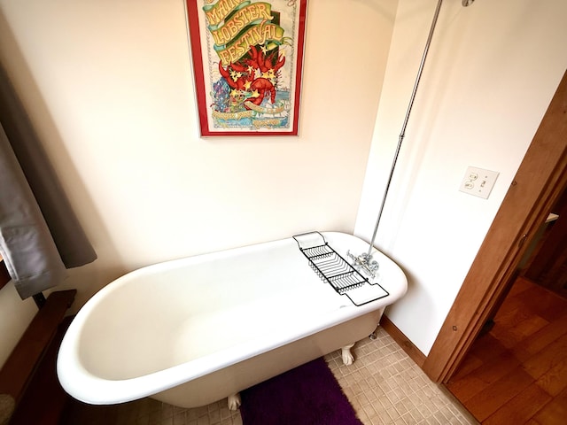 bathroom featuring a soaking tub