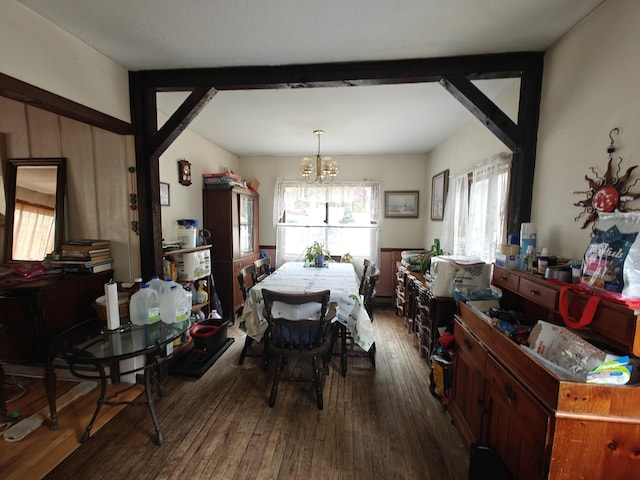 dining room featuring hardwood / wood-style flooring and a chandelier