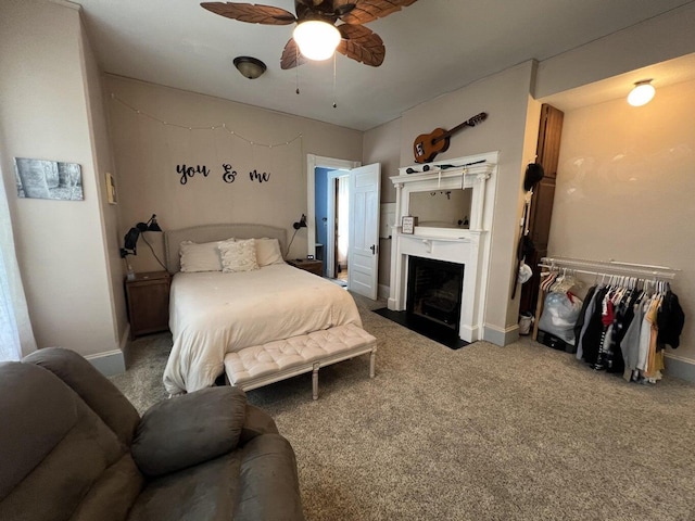 475 Main St, Van Buren, ME 04785 - carpeted bedroom featuring a fireplace with flush hearth, baseboards, and ceiling fan