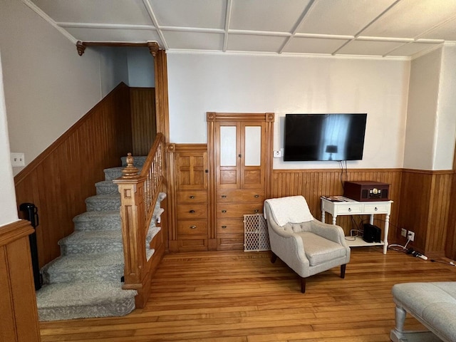 475 Main St, Van Buren, ME 04785 - living area with wainscoting, hardwood / wood-style floors, stairs, and wooden walls