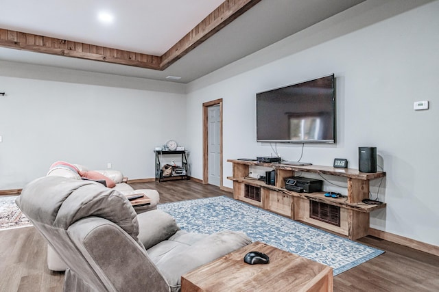 living area featuring wood finished floors and baseboards