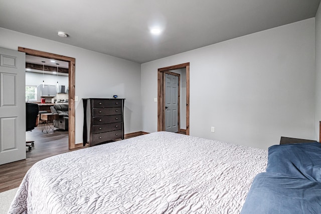 bedroom with wood finished floors